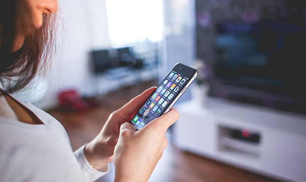 woman looking at her phone